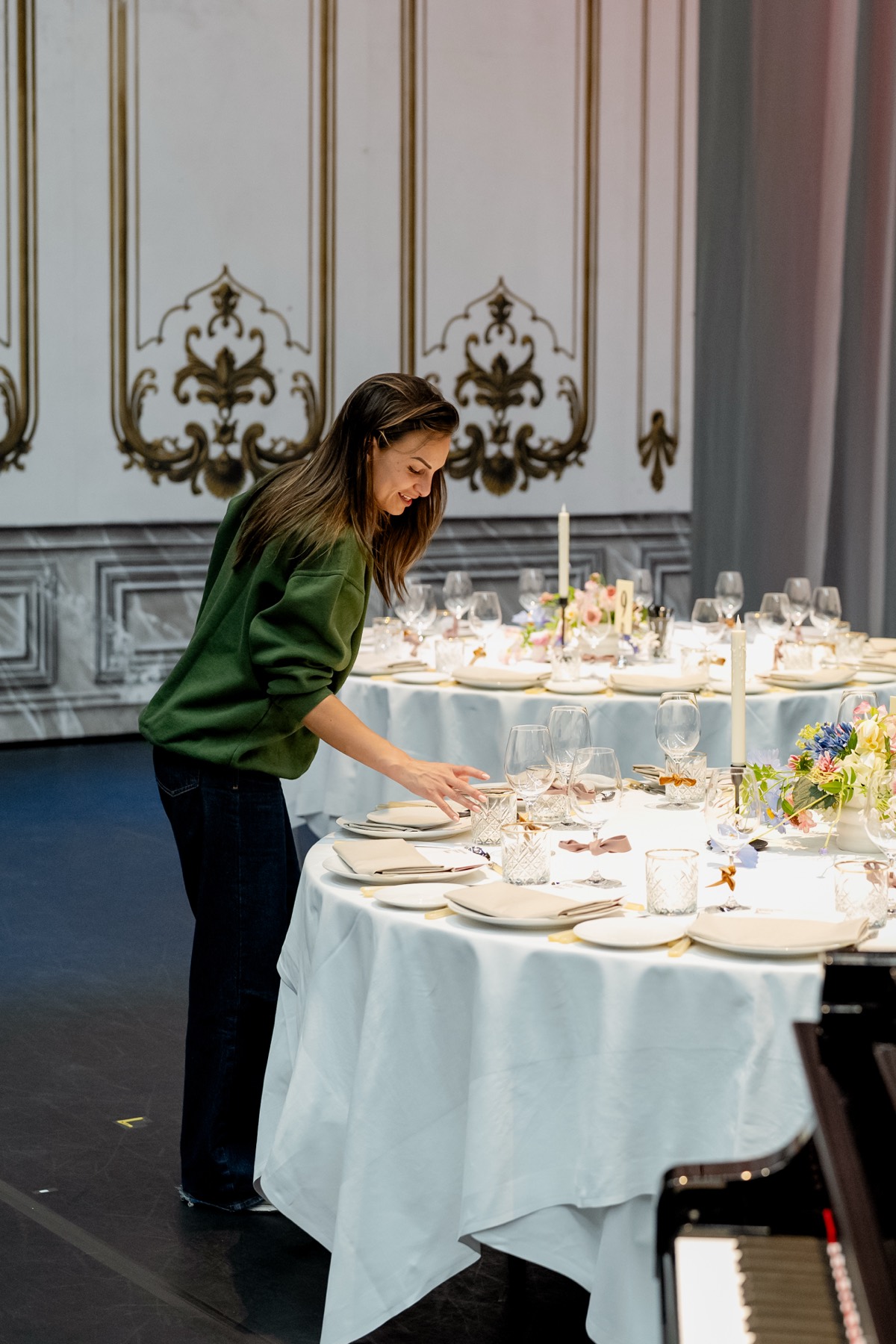 Final check of the place settings and AP Bloem's florals at the round dinner tables