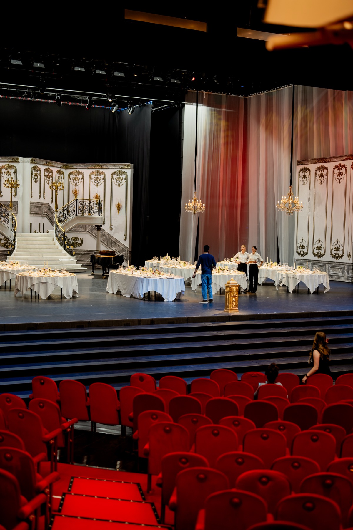 View from the auditorium: dressed tables among the stage sets at the Dutch National Opera & Ballet