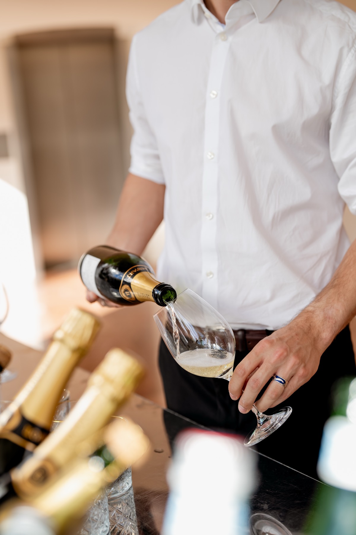 Champagne being poured during the reception with amuse-bouches and welcome drinks