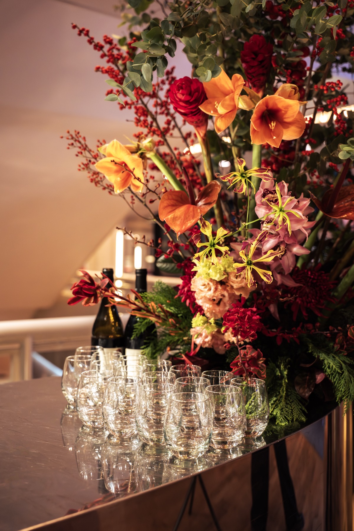 Floral arrangement above a champagne tower at one of our events