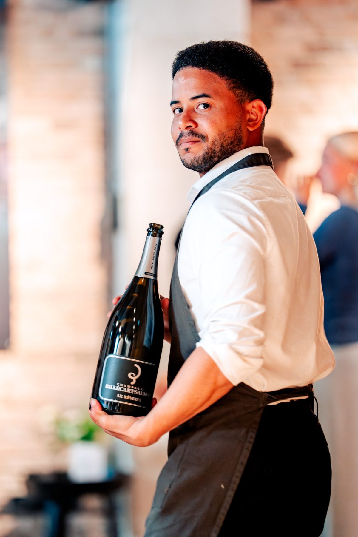 Waiter with a magnum of Billecart-Salmon at KITCHEN 55