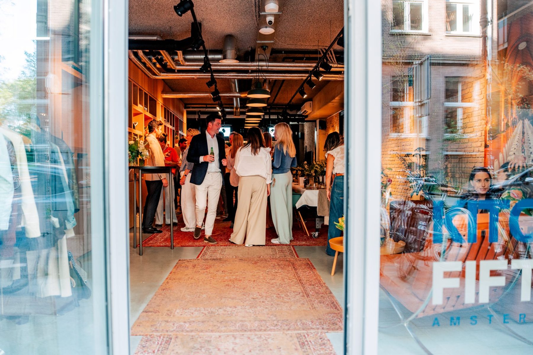 Guests talking at the entrance of KITCHEN 55